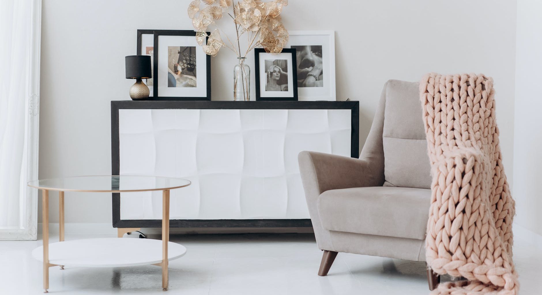 beige sofa chair near a table