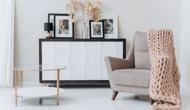 beige sofa chair near a table