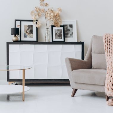 beige sofa chair near a table