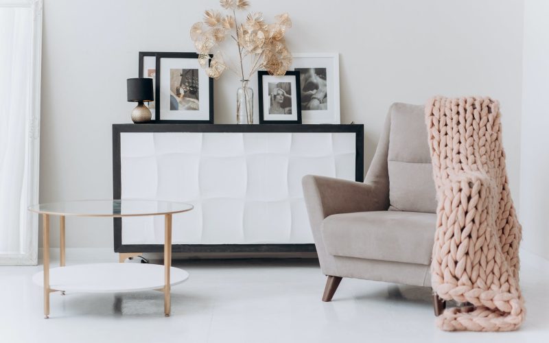 beige sofa chair near a table