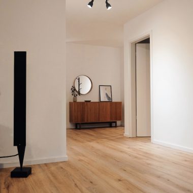 black tower speaker beside white wall