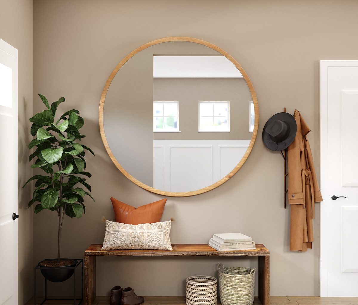 brown wooden framed mirror on white wall