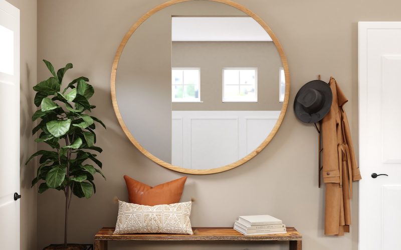 brown wooden framed mirror on white wall
