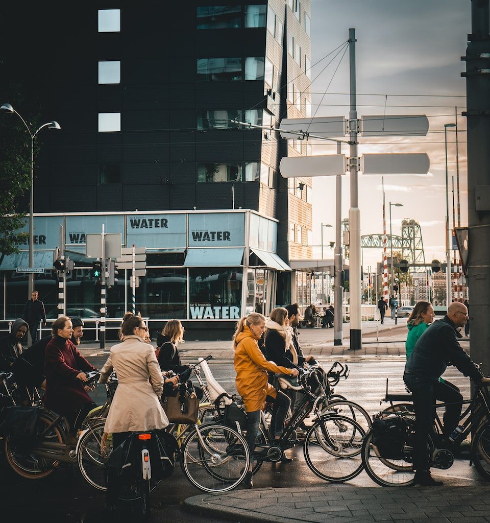 men and women riding on bikes on road