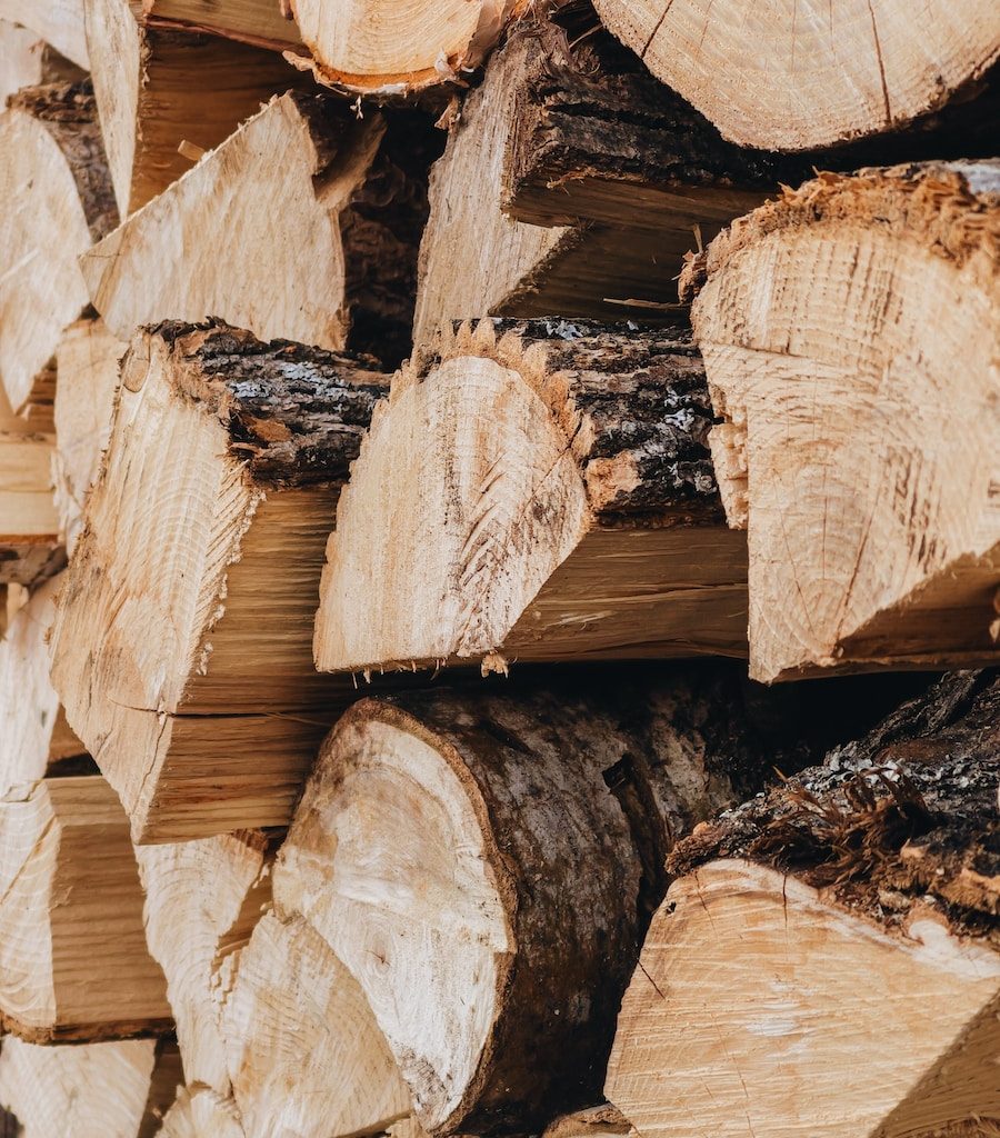 brown wood logs in close up photography