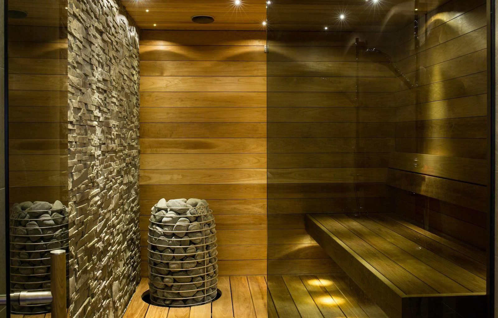 brown wooden round table near gray concrete wall