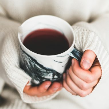 person holding cup of coffee