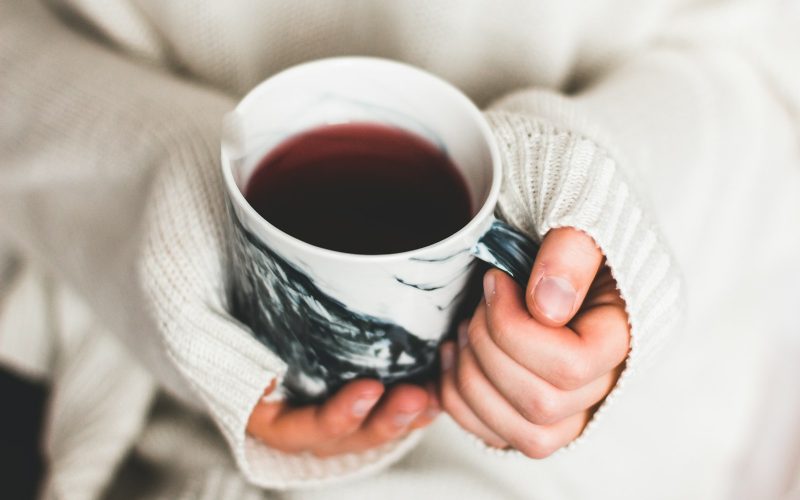 person holding cup of coffee