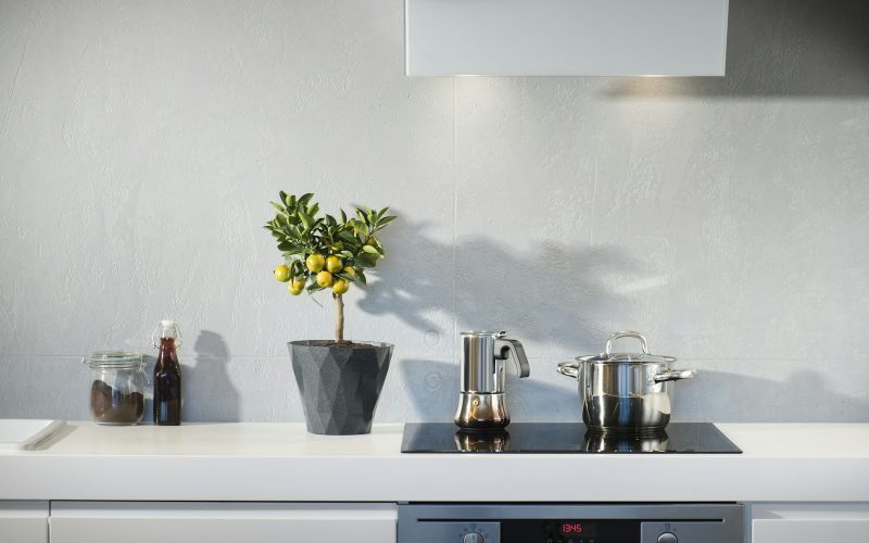 silver pot on top of induction oven