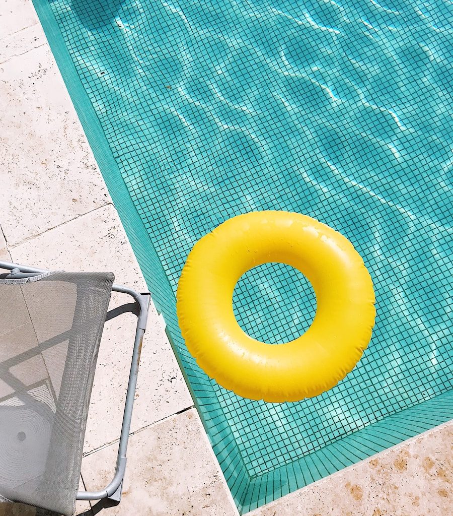 yellow plastic round toy on green table