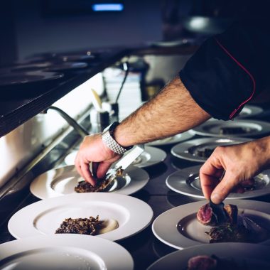 person preparing cooked dish