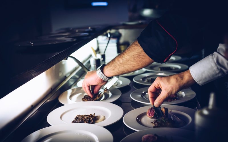 person preparing cooked dish