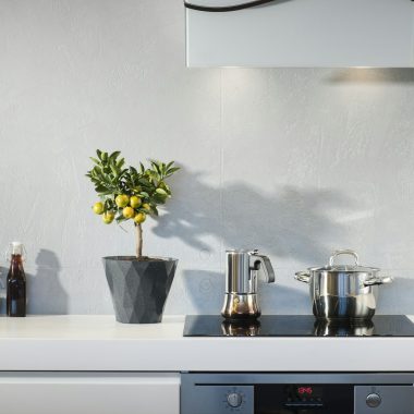 silver pot on top of induction oven