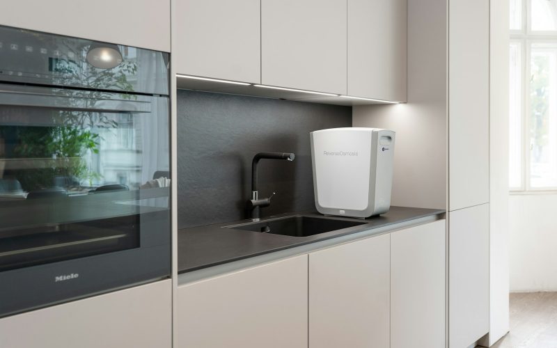 a kitchen with white cabinets