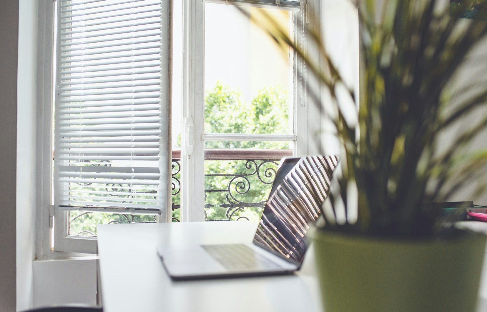 white and black striped chair near window
