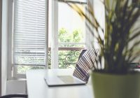 white and black striped chair near window