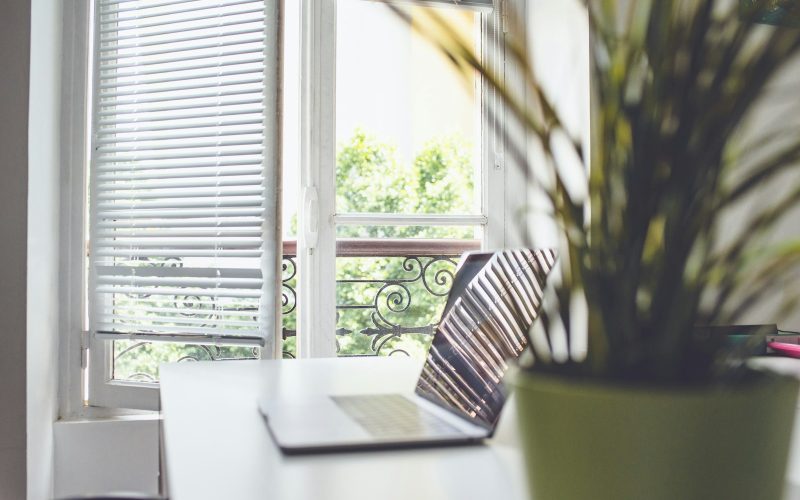 white and black striped chair near window