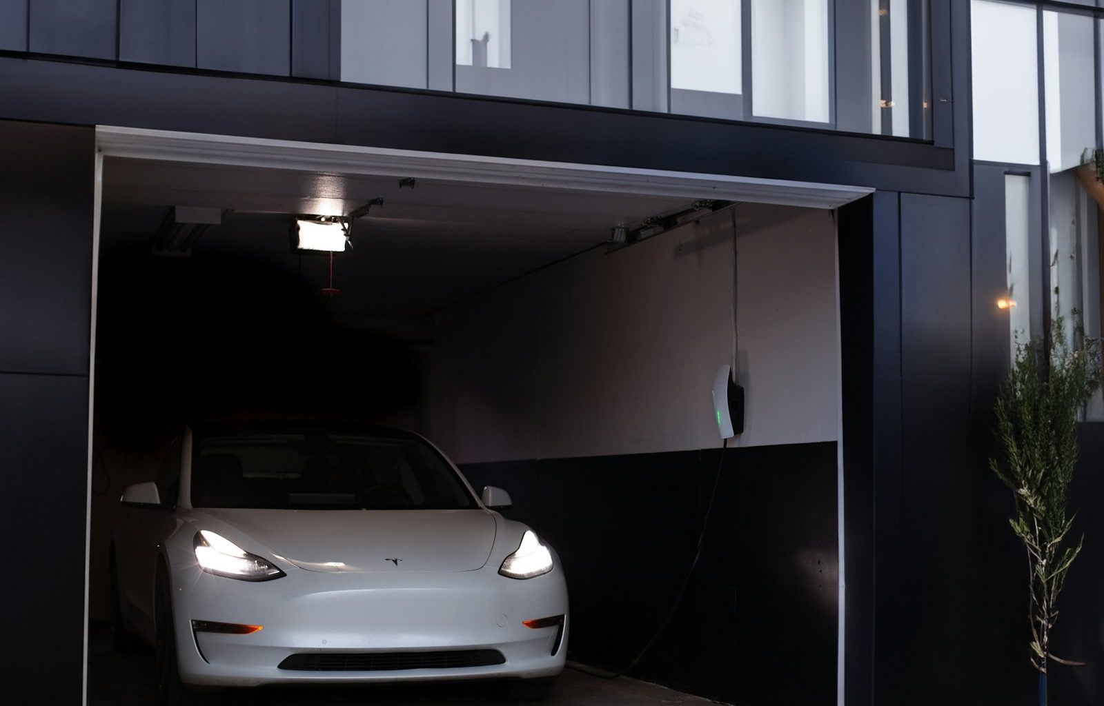 a white car is parked in a garage