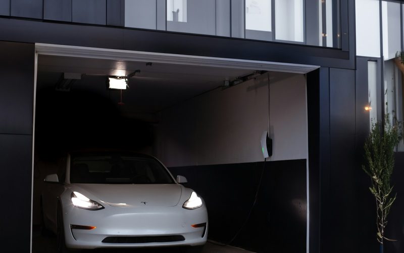 a white car is parked in a garage