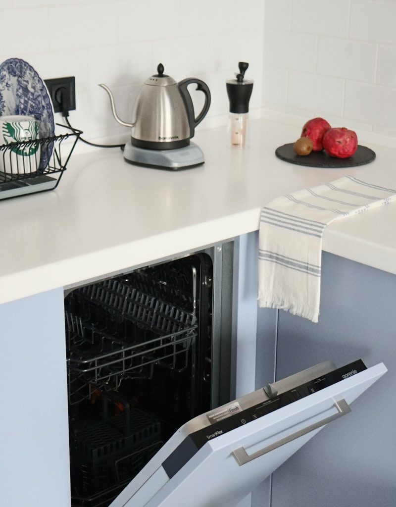 stainless steel kettle on white kitchen counter