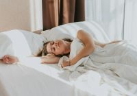 a person lying in a bed
