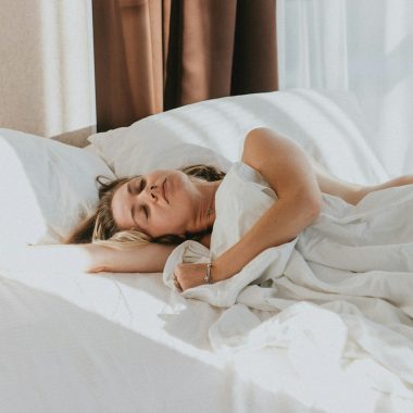 a person lying in a bed