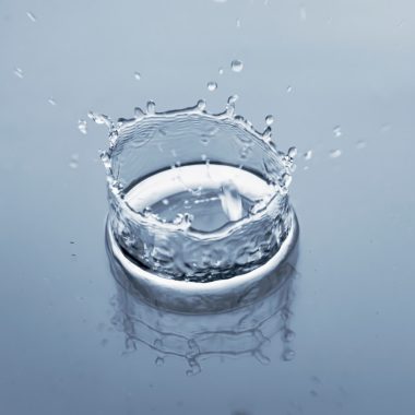 a glass of water with ice