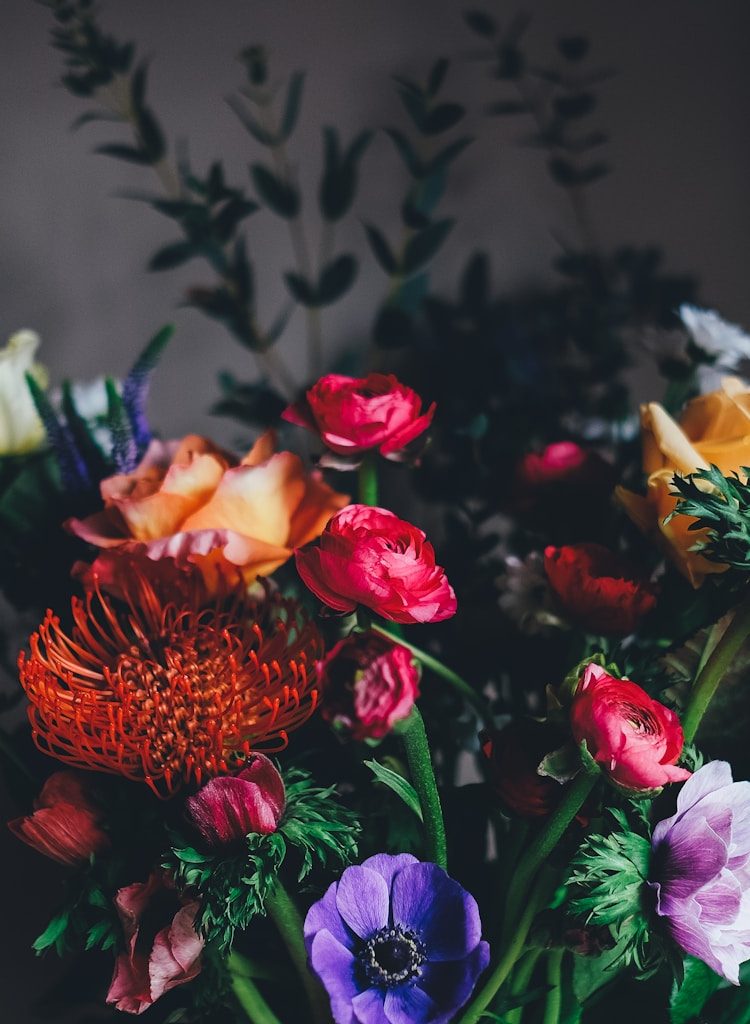 assorted petaled flowers centerpiece inside room
